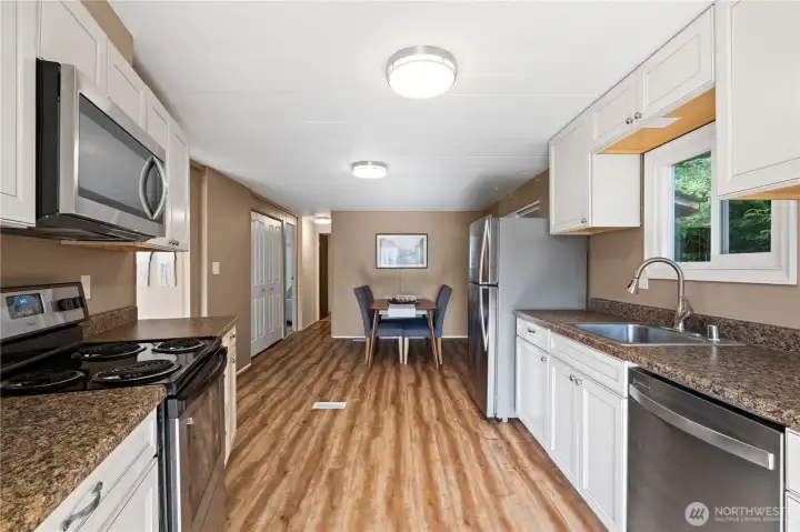 Newer cabinets and flooring in spacious kitchen Newer cabinets and flooring in spacious kitchen
