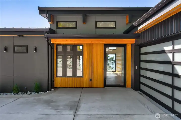 A grand wooden entrance showcasing luxury and contemporary elegance.
