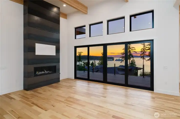 Floor-to-ceiling views frame stunning San Juan Island sunsets.