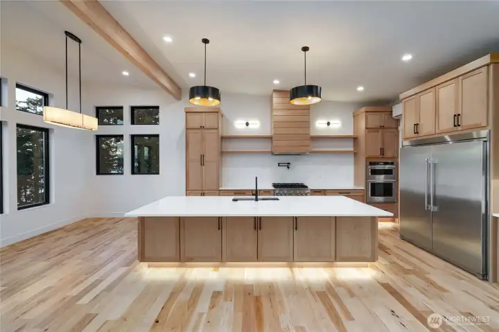 Premium finishes complete this clean & contemporary chefs kitchen with large island.