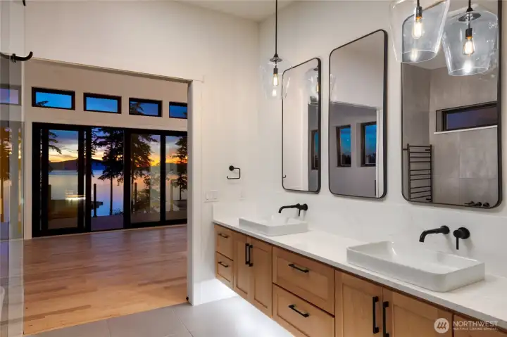 Custom primary ensuite with dual vanities and premium finishes.