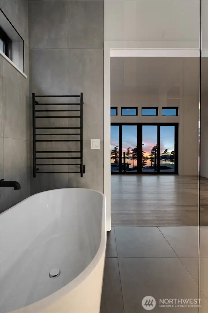 Spa-inspired primary bath with luxury finishes and water-view retreat.
