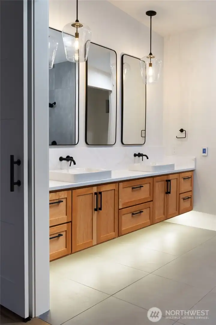 Premium finishes and spa-like comfort define this primary retreat.