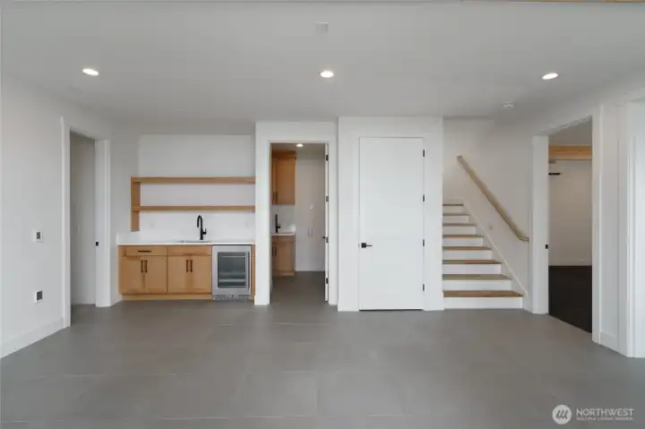 Family/flex room downstairs with mini-bar.