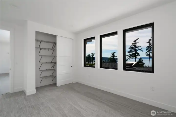 Bedroom with abundance of natural light.