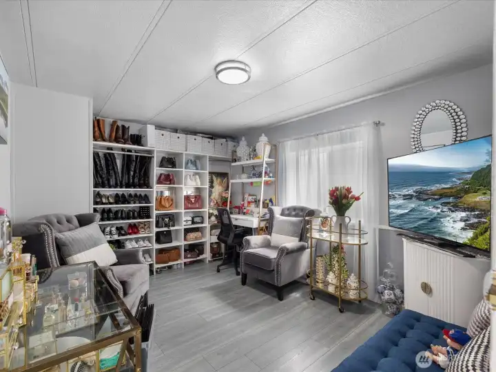 2nd bedroom with built in closet space for designer accessories and tv room. (water heater located in this room)