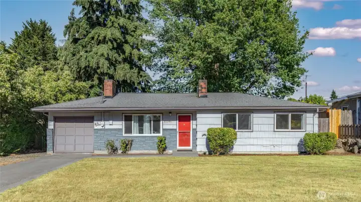 Classic SeaTac rambler with standout red front door, attached garage, hardwood floors, updated systems, and a large private backyard. Ideally located near Angle Lake, SeaTac Airport, Link Light Rail, parks, shopping, dining, and major commuter routes throughout the Puget Sound region.