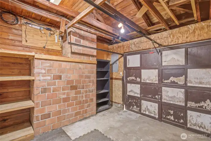 Attached garage offering off-street parking, built-in shelving, workshop potential, and abundant storage space. Ideal for tools, outdoor gear, seasonal storage, and home projects.