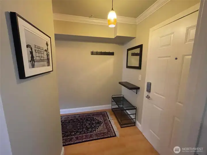 The entry has enough room for a small take or bench. The entry has enough room for a small take or bench.