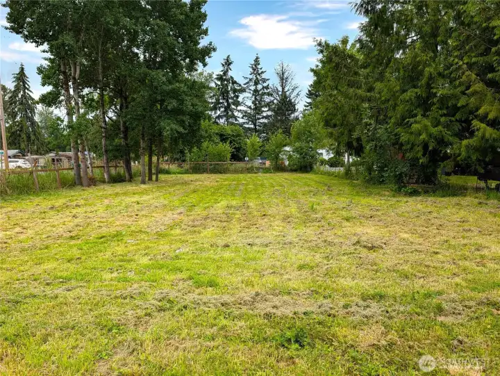 Looking from south to north shows most of the lot.  Mature trees for built in privacy.  Mostly fenced.
