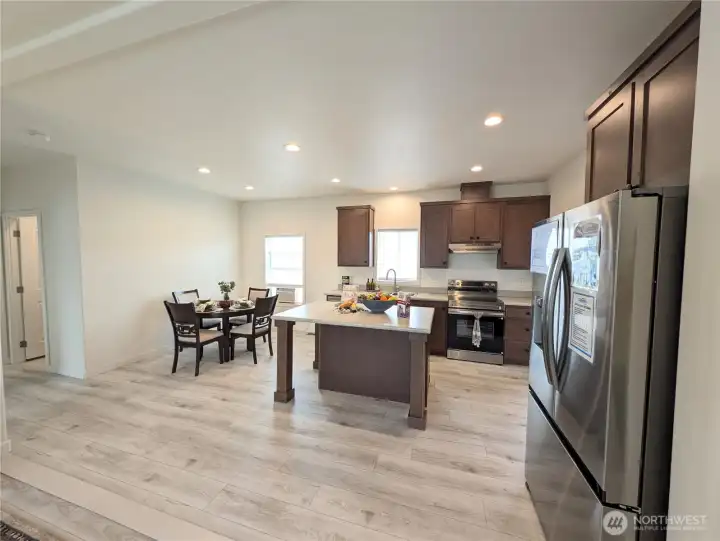 Model Home: Kitchen & dining area. Stainless appliances.