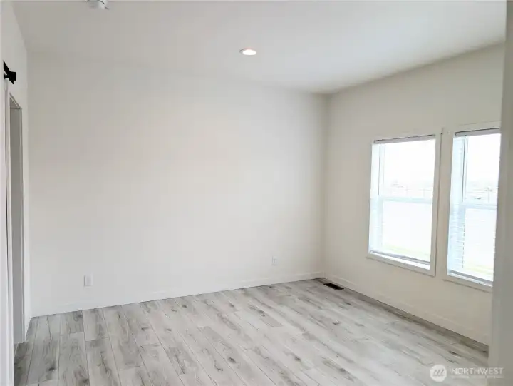 Model Home: Primary bedroom with walk-in & 3/4 bath off.