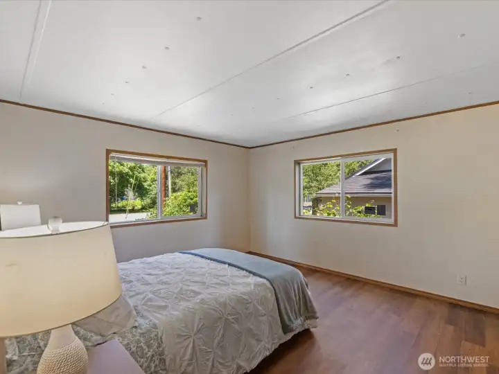 Primary suite is located off the living room side of the home. Primary suite is located off the living room side of the home.