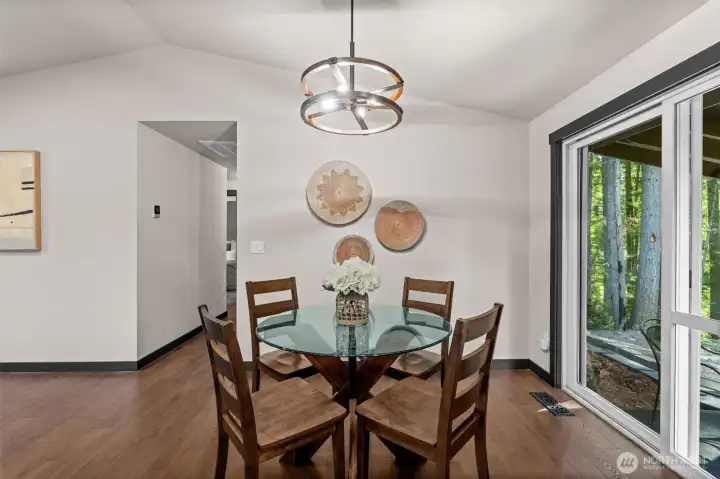 Perfectly positioned for easy flow, this beautiful dining space balances modern finishes with cozy, organic textures to make every gathering feel special. Perfectly positioned for easy flow, this beautiful dining space balances modern finishes with cozy, organic textures to make every gathering feel special.