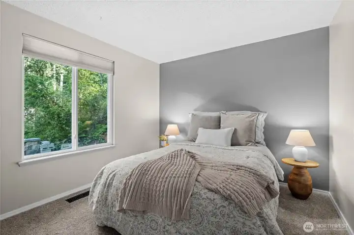 Flooded with natural light and finished in a soothing, neutral palette, this spacious bedroom offers a peaceful haven that effortlessly matches the aesthetic of the rest of the home. Flooded with natural light and finished in a soothing, neutral palette, this spacious bedroom offers a peaceful haven that effortlessly matches the aesthetic of the rest of the home.