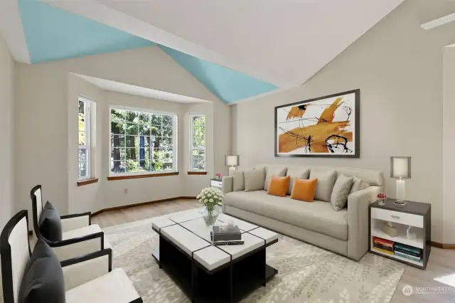 Entering the home, you are greeted to soaring ceilings and a spacious living room.