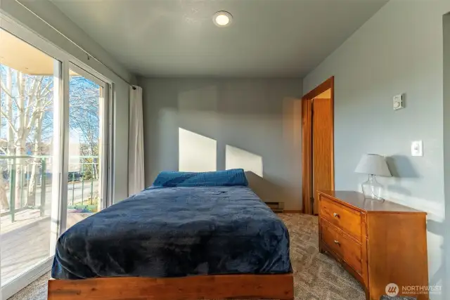 Second bedroom with sliding door leading to deck.