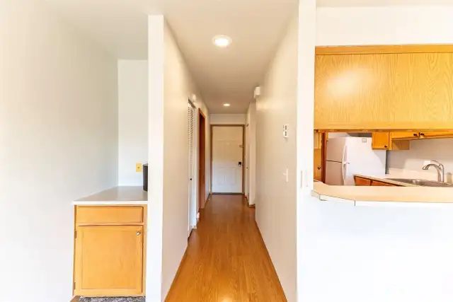 Pantry, coat closets and primary bedroom and bath off entry hallway