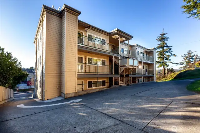 Designated back of building parking  space. Easy access to condo at middle of building.