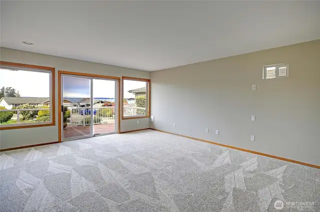 Generous primary suite with views and deck access.