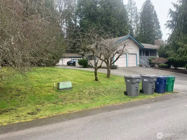 House and detached 3-car garage behind.