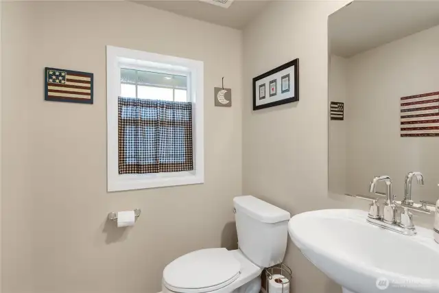 Half bath at the bottom of the stairs.