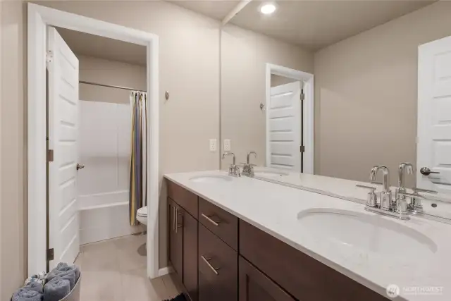 Large upstairs bathroom with modern finishes.