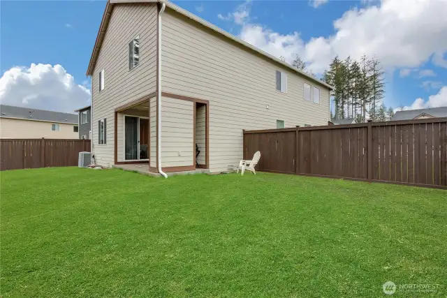 This fence, on the right, can be moved forward to make the backyard bigger. (Grass has been digitally edited in this corner, a dog run was removed, sellers are planting seed.)