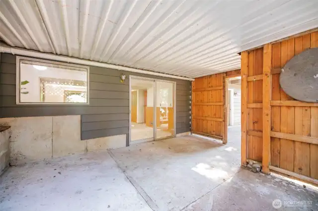 Large covered outdoor patio area off the lower bonus room.