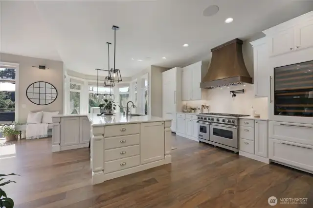 Chefs kitchen:  Custom cabinets, including pull-outs, organizers, soft-close hinges, solid iron hardware, under cabinet lighting.  Under counter Kangen water system,  Restoration Hardware Lighting,  Quartz counters with custom edge detail,  Walk-in pantry w/ coffee bar,  Custom cabinet-matched Sub-Zero commercial refrigerator,  Wolf Warming Drawer w/serving containers,  Built-in cabinet matching Sub Zero Wine Fridge with Cold Beverage Drawers,  48” Viking Gas Range w/ double ovens & skillet,  Pot filler,  Custom Range hood
