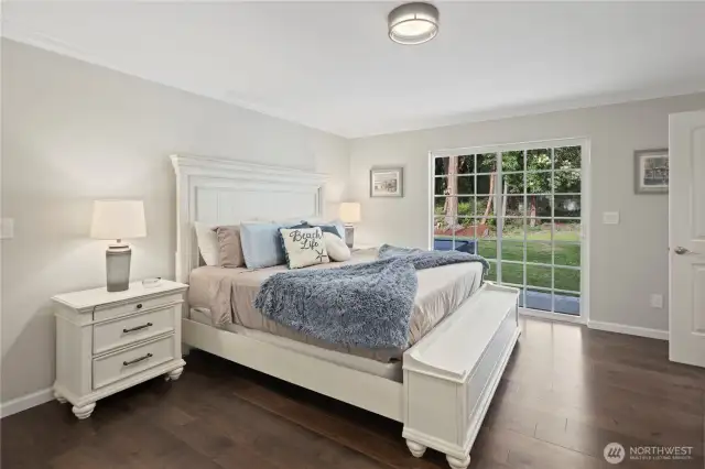 Primary bedroom doors lead to backyard hot tub...Jump right in!