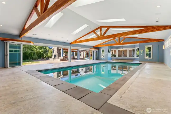 Charming pool house, complete with a self filling pool and hot tub, a dedicated ballet studio and professional-grade dog kennels. Open the expansive bifold glass doors, inviting the beauty of the outdoors in; where you can go relax by the outdoor fireplace.
