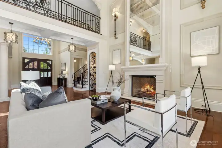 The main residence showcases bespoke craftsmanship, stately columns that exude elegance, wrought iron rails that reveal the living room below and soaring ceilings that evoke a sense of grandeur.