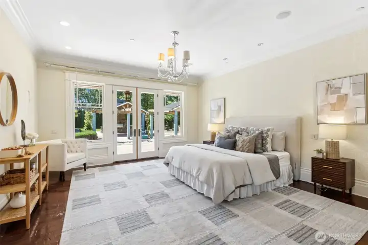 This primary bedroom is huge and and accesses the heated back patio and courtyard.