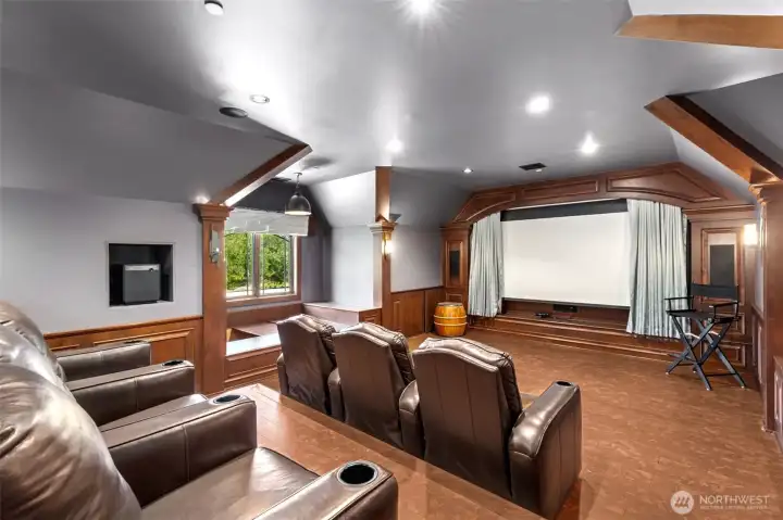 Escape to this private movie room where you can host slumber parties on plush queen-sized beds or sip wine in the intimate kitchenette.