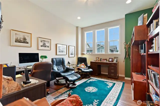 Off the kitchen is a den/office area.