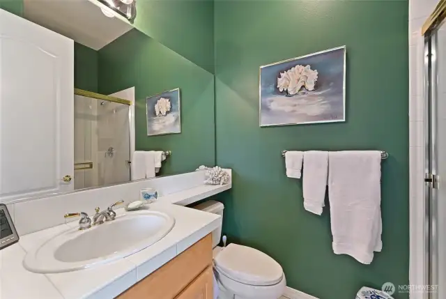 The bathroom off the second bedroom has a step-in shower.