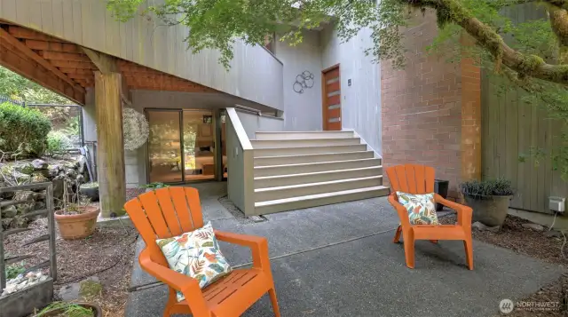Inviting outdoor seating area at the private entry, perfect for morning coffee or evening unwinding.