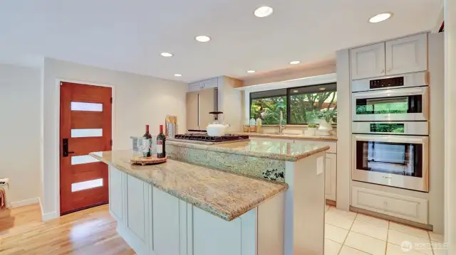 All appliances are included—featuring a double oven and sleek stainless steel refrigerator.