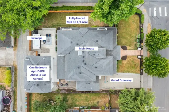 Seated on a corner, quarter-acre lot, the property includes the main house, the detached three car garage, the ADU/apartment above the garage, 14-ft swim spa, and fully fenced in yard. Plenty of garage parking, but also driveway parking in front for multiple cars!