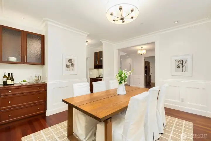 Note the wet bar area to the left - and the additional wet bar pictured in the top center of the photo. That space leads to the kitchen. There you'll also find the walk-in pantry in the same area leading to the kitchen.