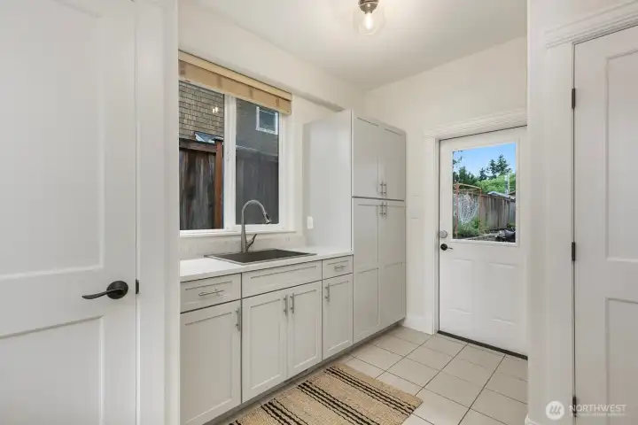 On the other side of the kitchen, the remodeled mudroom sits, as well as utility closets.