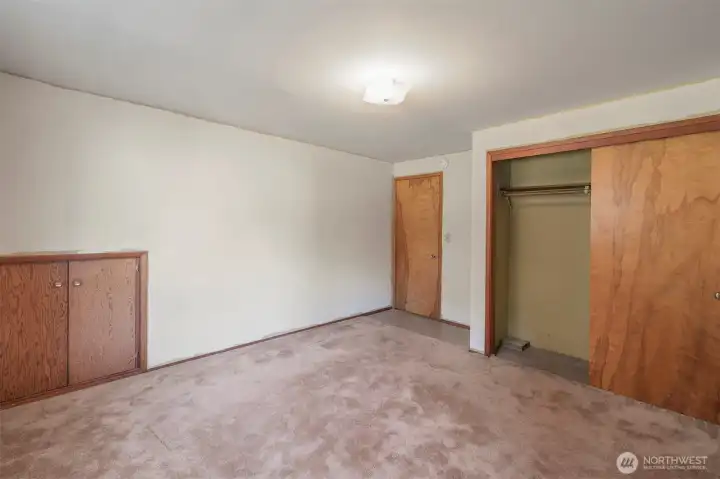 Basement bedroom with under the stairs access for extra storage