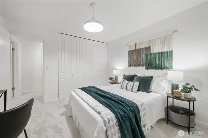 Comfortable bedroom features a generous closet with built-in organizers to maximize storage and style.