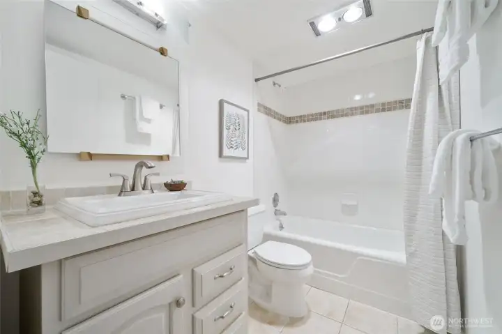 Stylish bathrooms feature designer tile and an oversized soaking tub for relaxation.