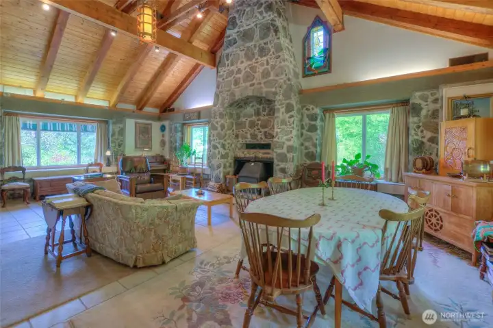 Dining area is in the far side of the expansive living room.