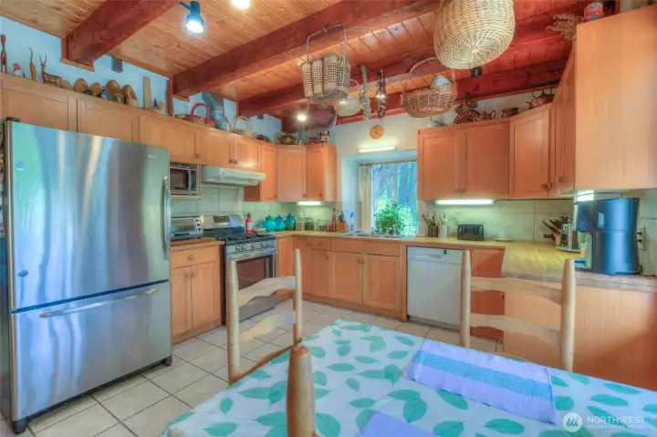 Seating area in the kitchen has natural light from a sunny south facing window.
