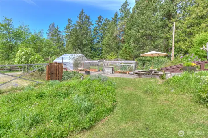 Picnic area off the stone patio and green house.