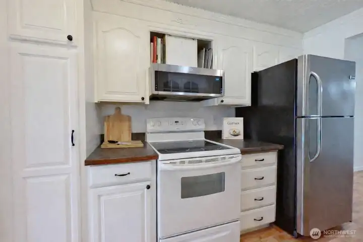 Efficient galley kitchen. Virtually staged.
