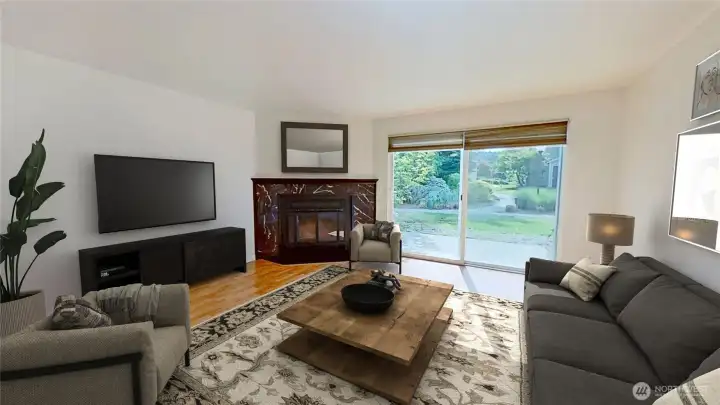 Living room with wood fireplace and slider to the garden patio. Virtually staged.